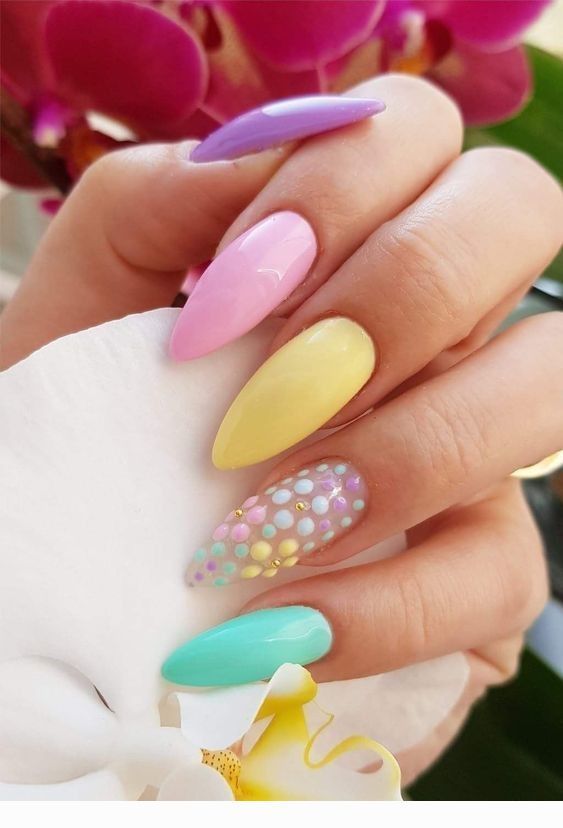 hands showing off nail polish pastel Easter colors and patterns