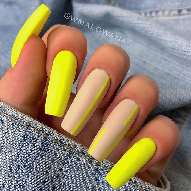 hands showing off nail polish neon yellow