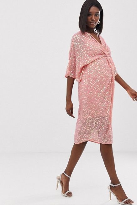 pregnant Lady wearing a pink sequin dress