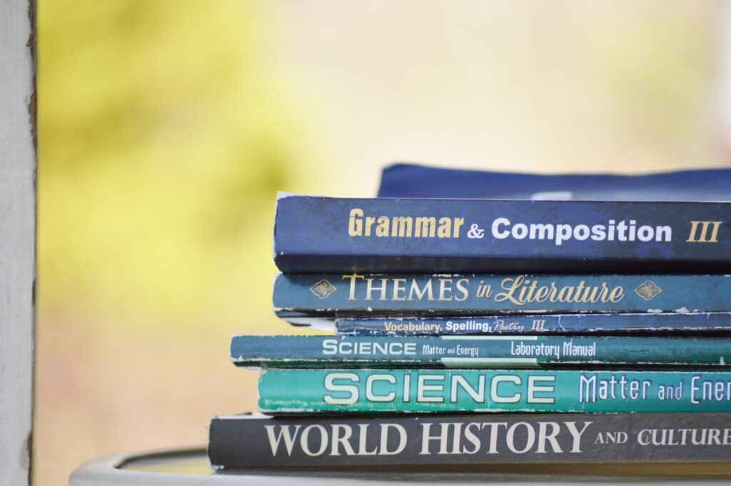 stack of text books in an article about how to get collorge or private high school text books for cheaper