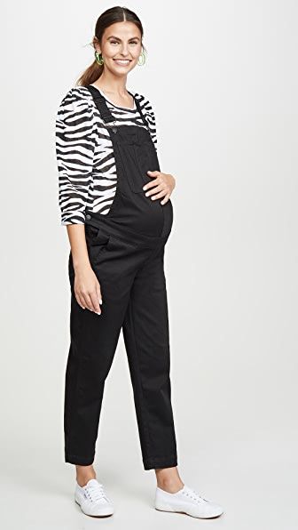 Lady wearing maternity overalls